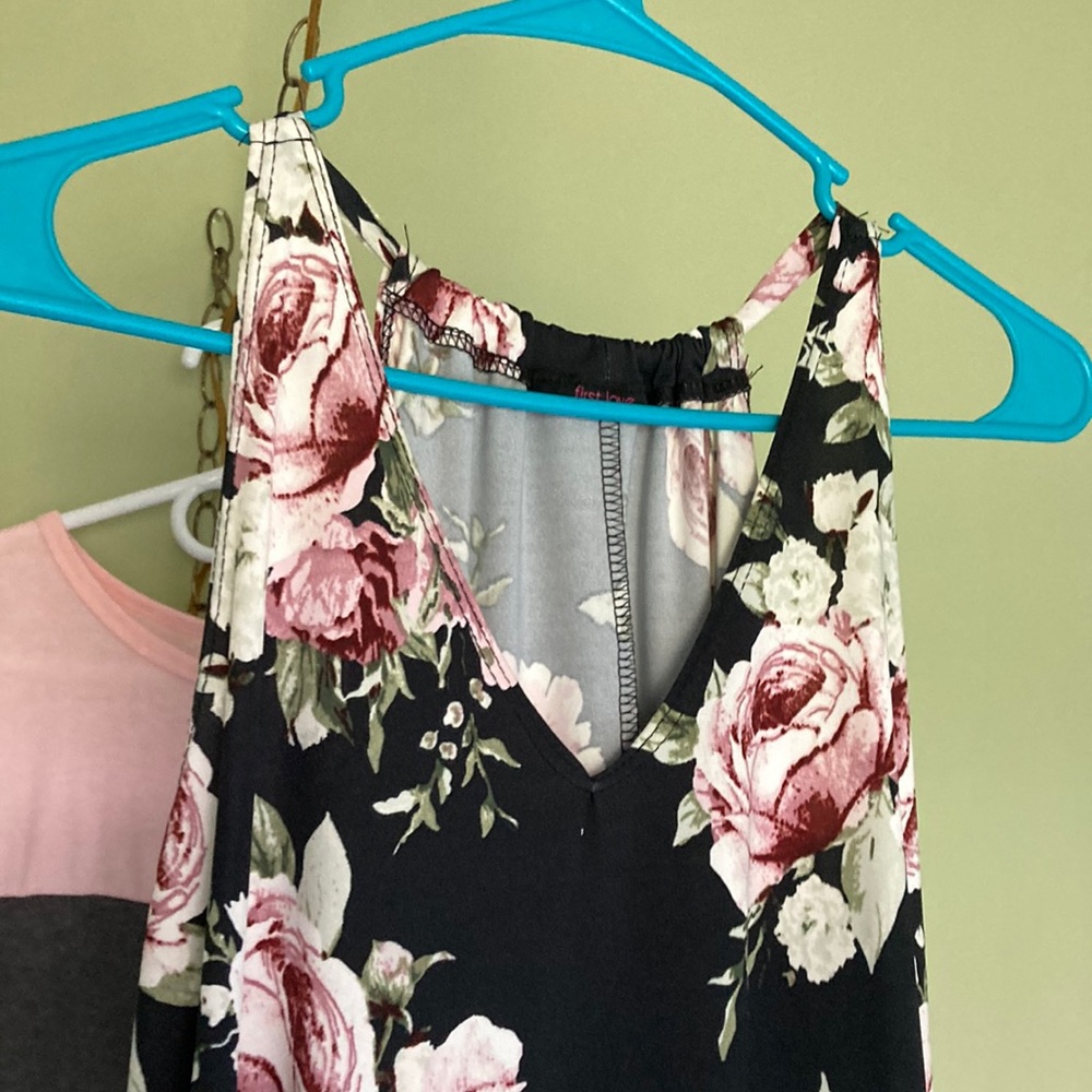 Asymmetrical blouse. Black with maroonish flowers
